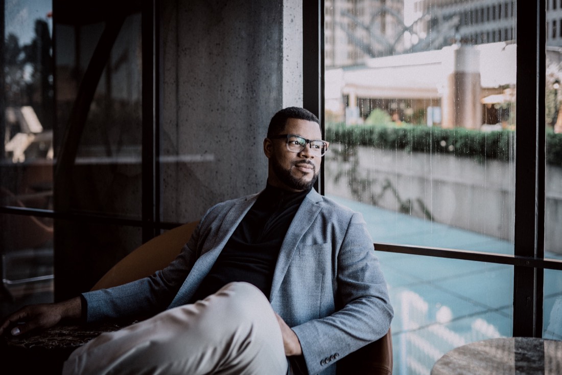 Terell Sterling seated by a window, photographed by Anastasia Blackman